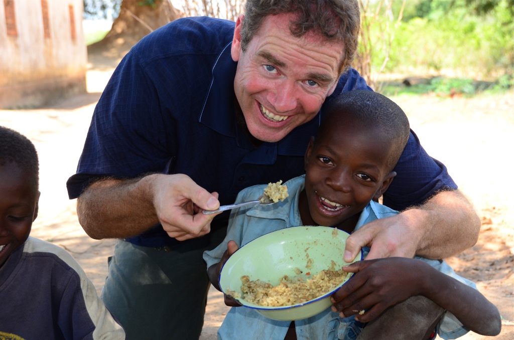 2 David Morrison assisting boy with  food