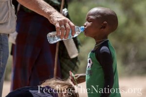 little boy drinking water
