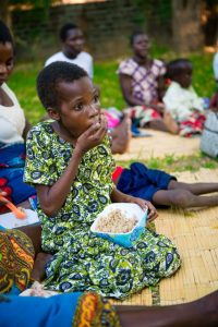 African girl eating