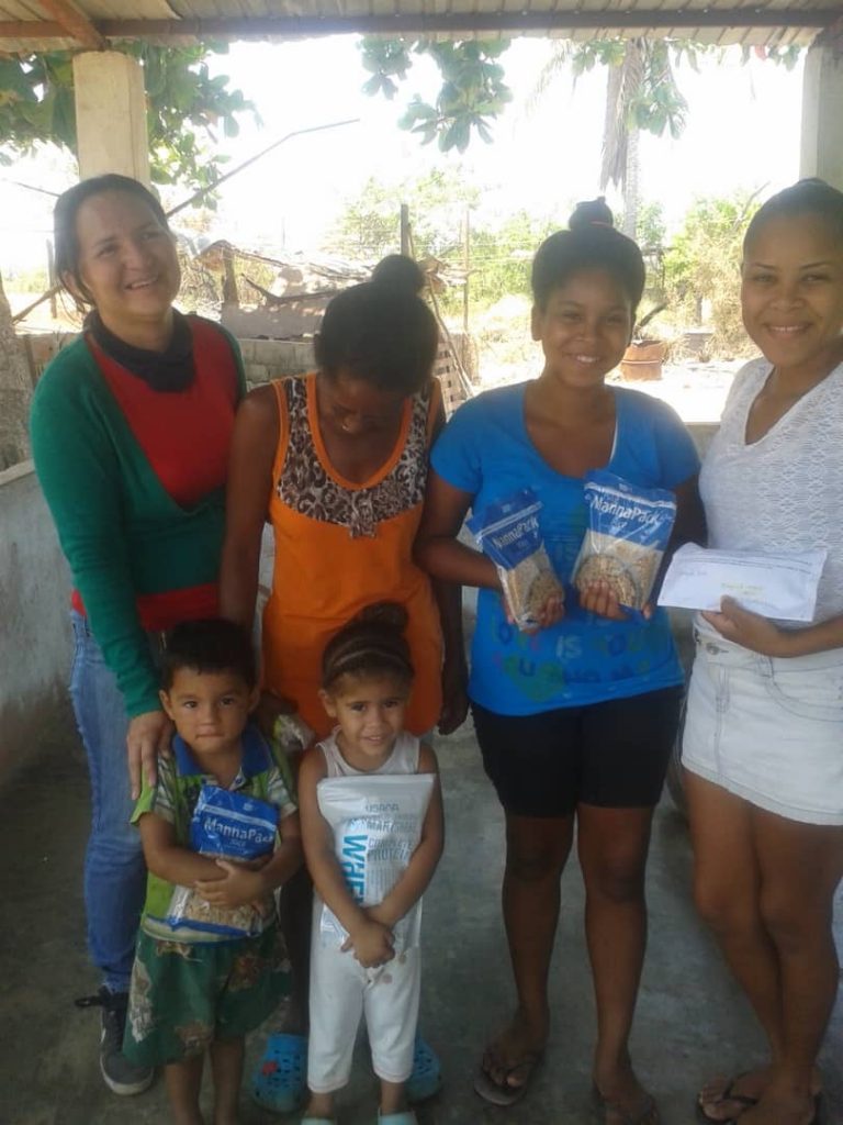 family holding bags of food